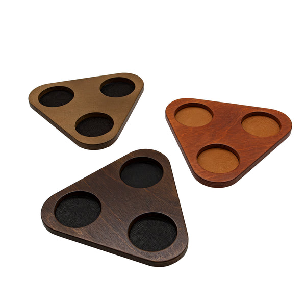 Three triangular wooden trays with multiple stains with 3 slots for glasses on a white background