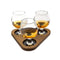 Three sniffer glasses on a dark walnut wooden tray with a white background