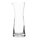 Clear glass carafe on a white background