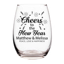 Clear glass wine glass with 'Cheers to the New Year' text and personalized names on a white background
