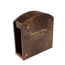 Wooden coaster holder with floral designs and engraved text on a white background