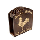 Wooden napkin holder with 'Avery's Kitchen' and rooster design on a white background