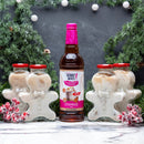 Bottle of Skinny Mixes gingerbread syrup with gingerbread man-shaped containers on a festive background.