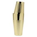 A polished gold cocktail shaker with a textured, diamond-patterned body, shown stacked with a matching gold lid on a plain white background.