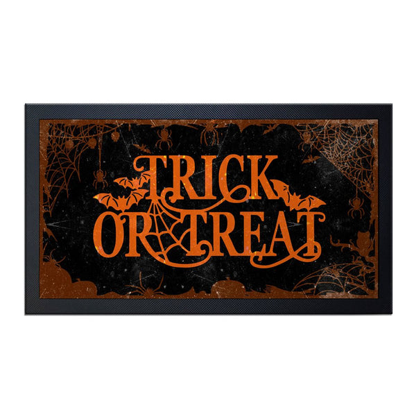 Halloween-themed mat with 'Trick or Treat' text and spider web design on a black background.