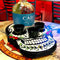 Cabo San Lucas tequila bottle with three black shot glasses on a decorative skull coaster.