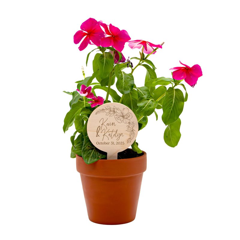 Wooden Planter Tag with engraved text and floral design on a white background in Plant