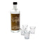 Bottle with a personalized label and four shot glasses on a white background